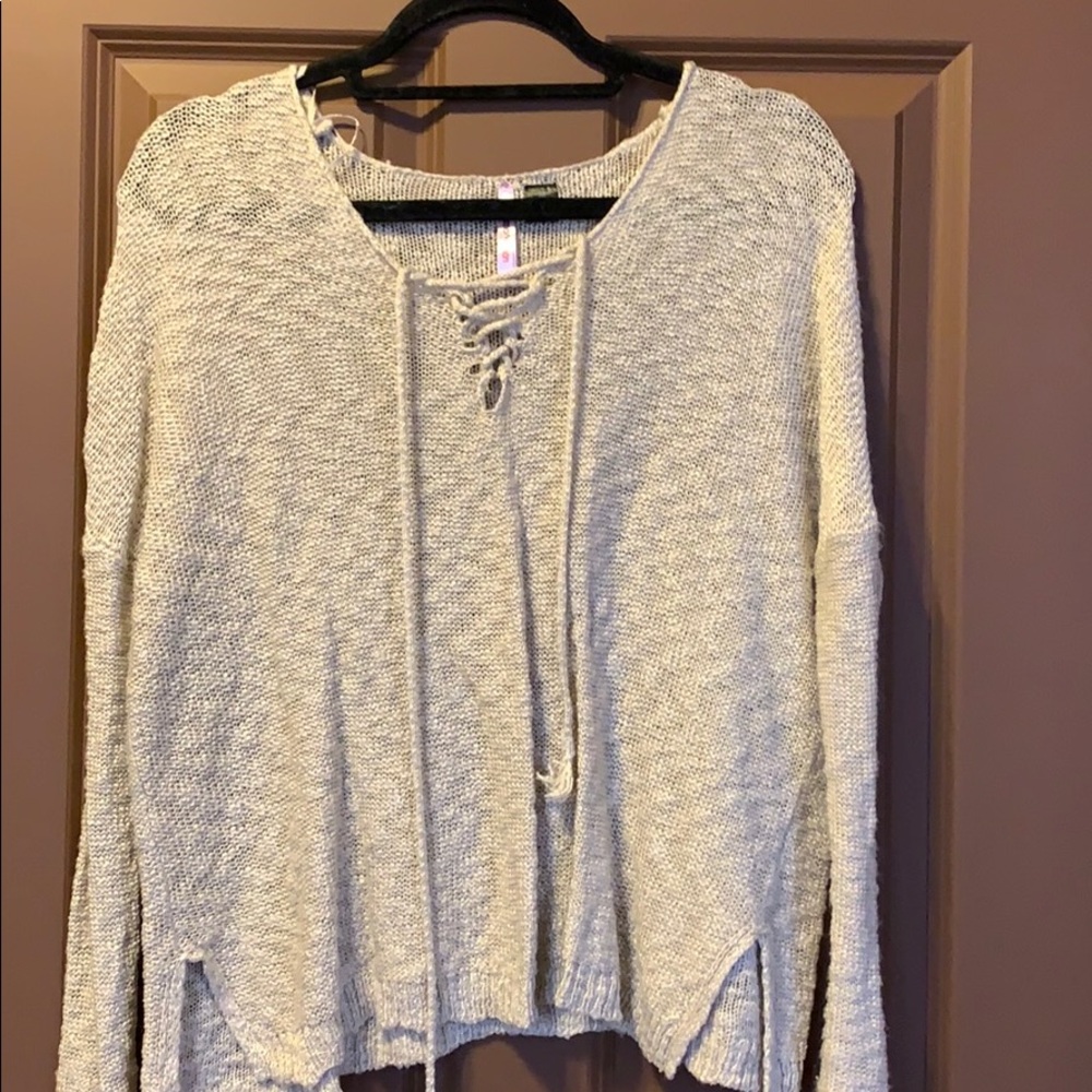 Long sleeve beige sweater.